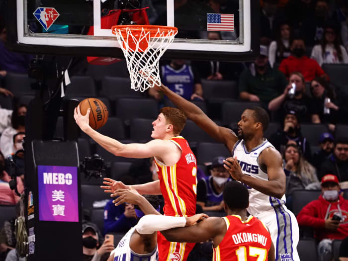 Jan 5, 2022; Sacramento, California, USA; Atlanta Hawks guard Kevin Huerter (3) scores a basket against Sacramento Kings forward Harrison Barnes (40) during the fourth quarter at Golden 1 Center.